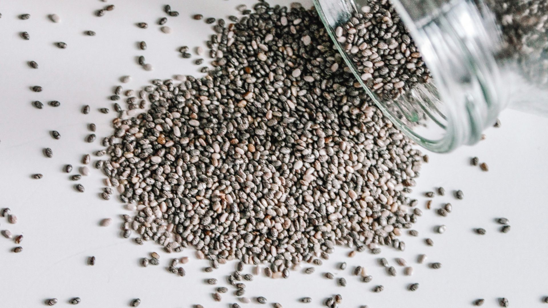 black beads in clear glass jar