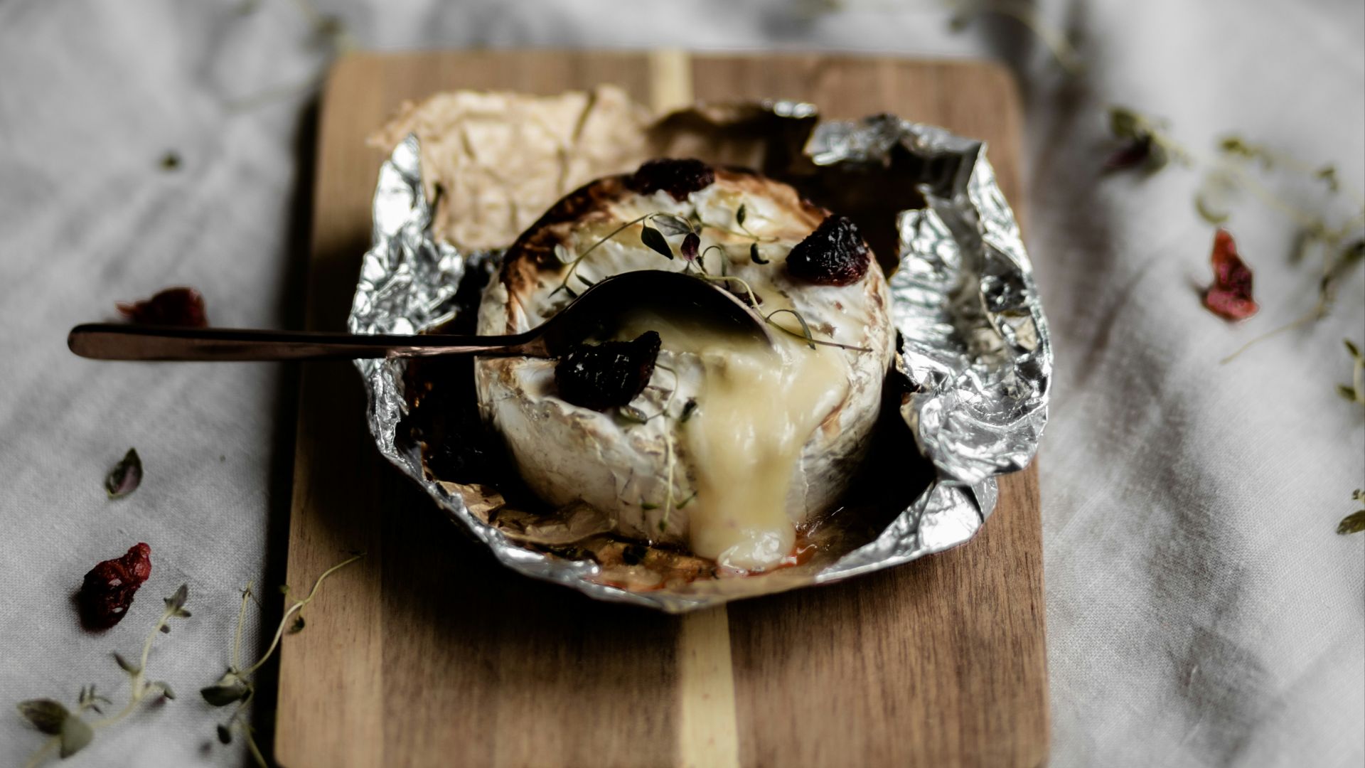 brown and white cake on brown wooden tray