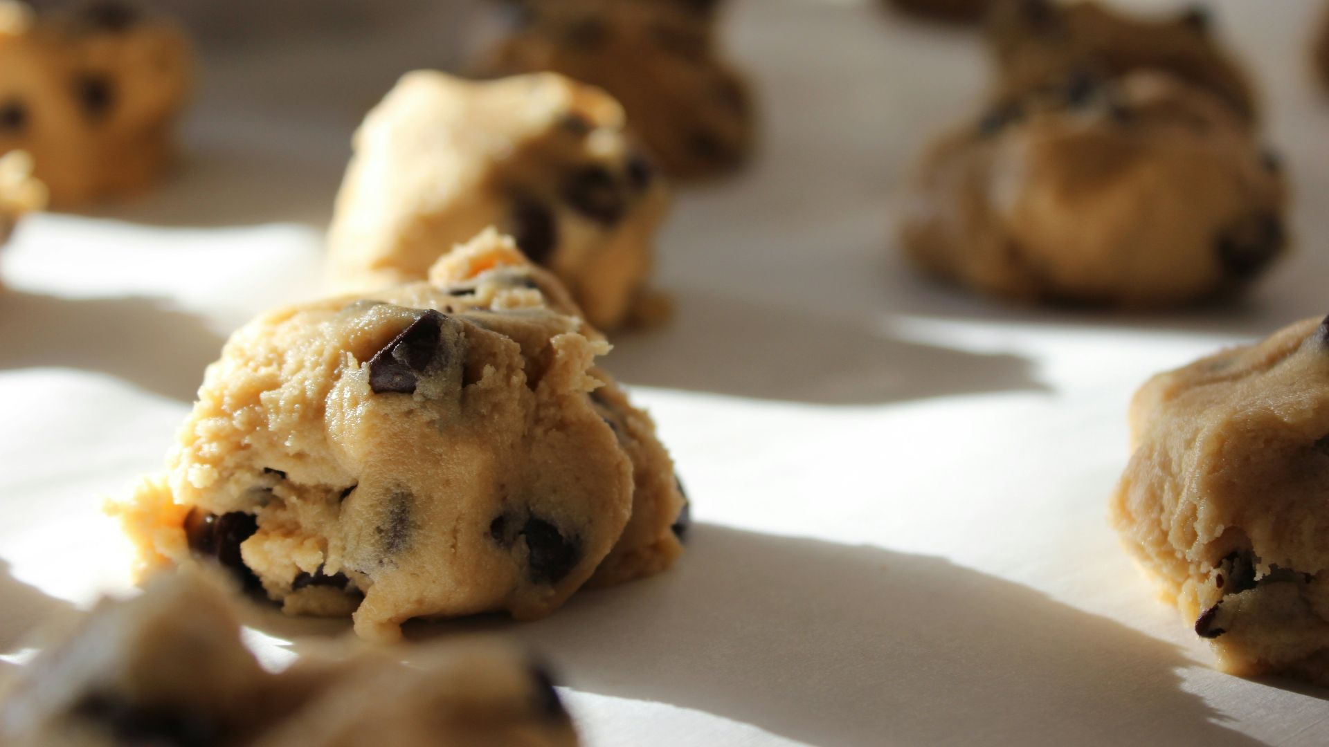 round chocolate cookies on white surface