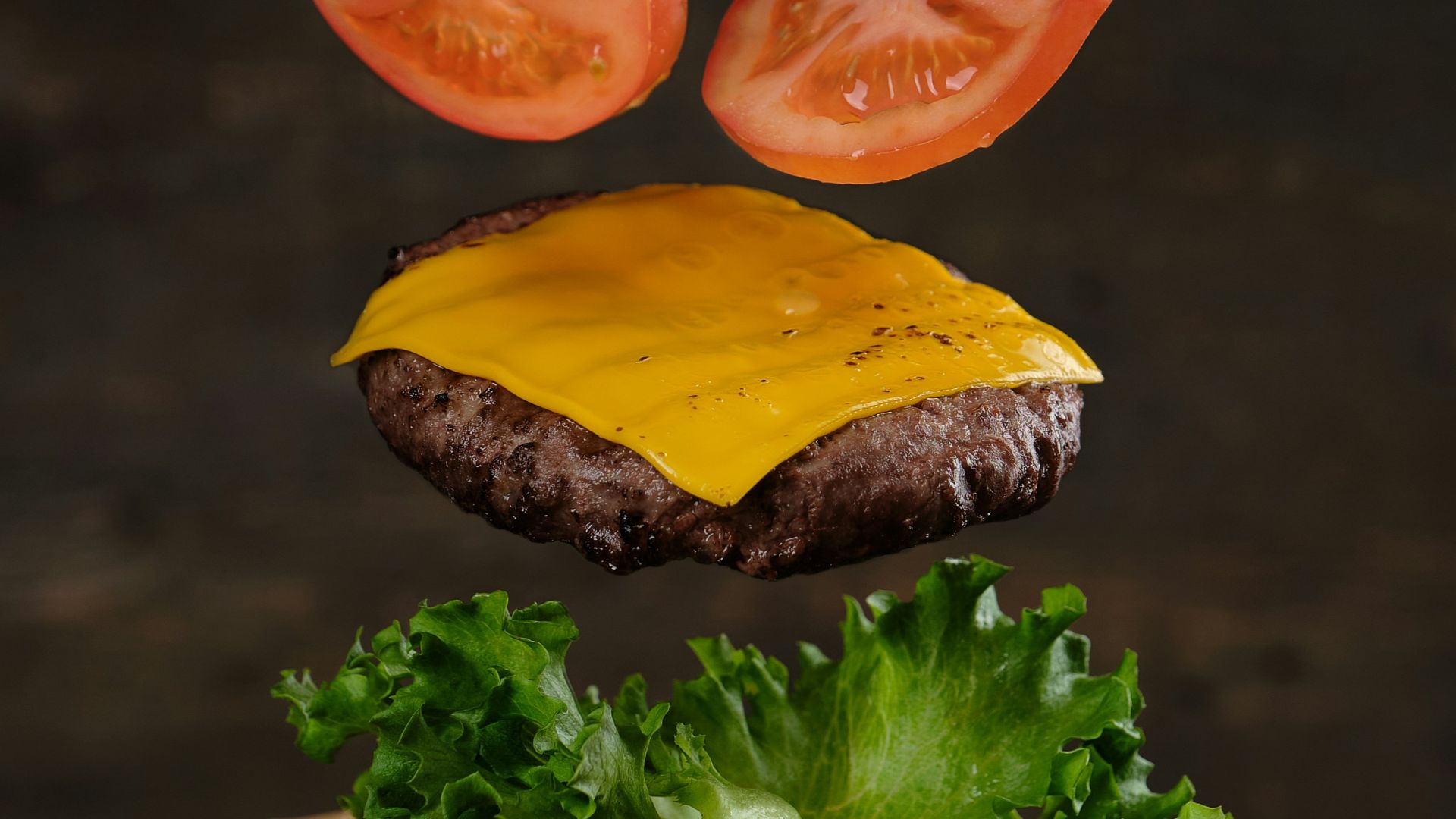 two burger with lettuce and tomato