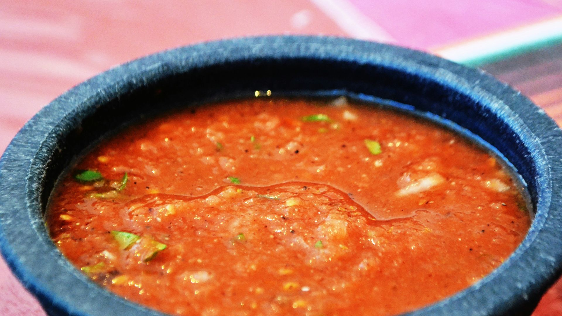 a bowl of soup sitting on top of a table