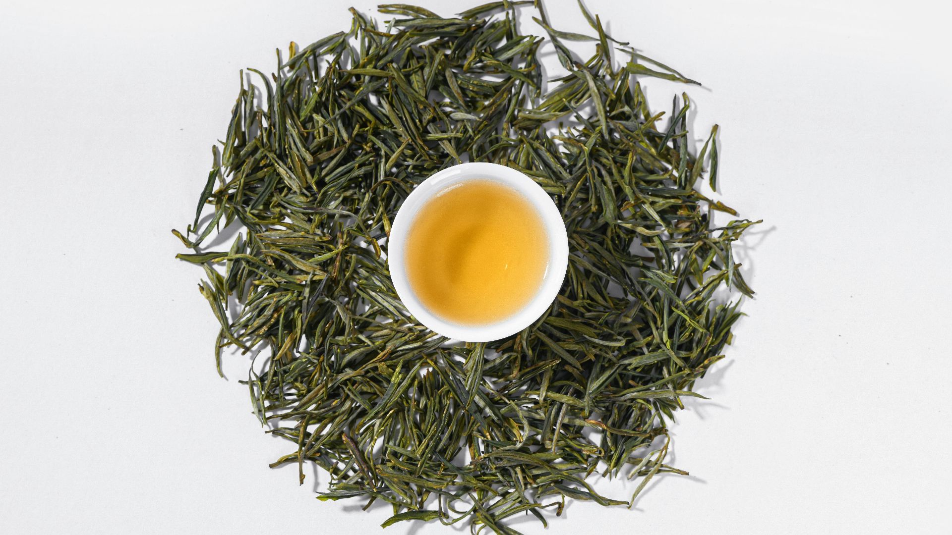 a cup of green tea on a white background