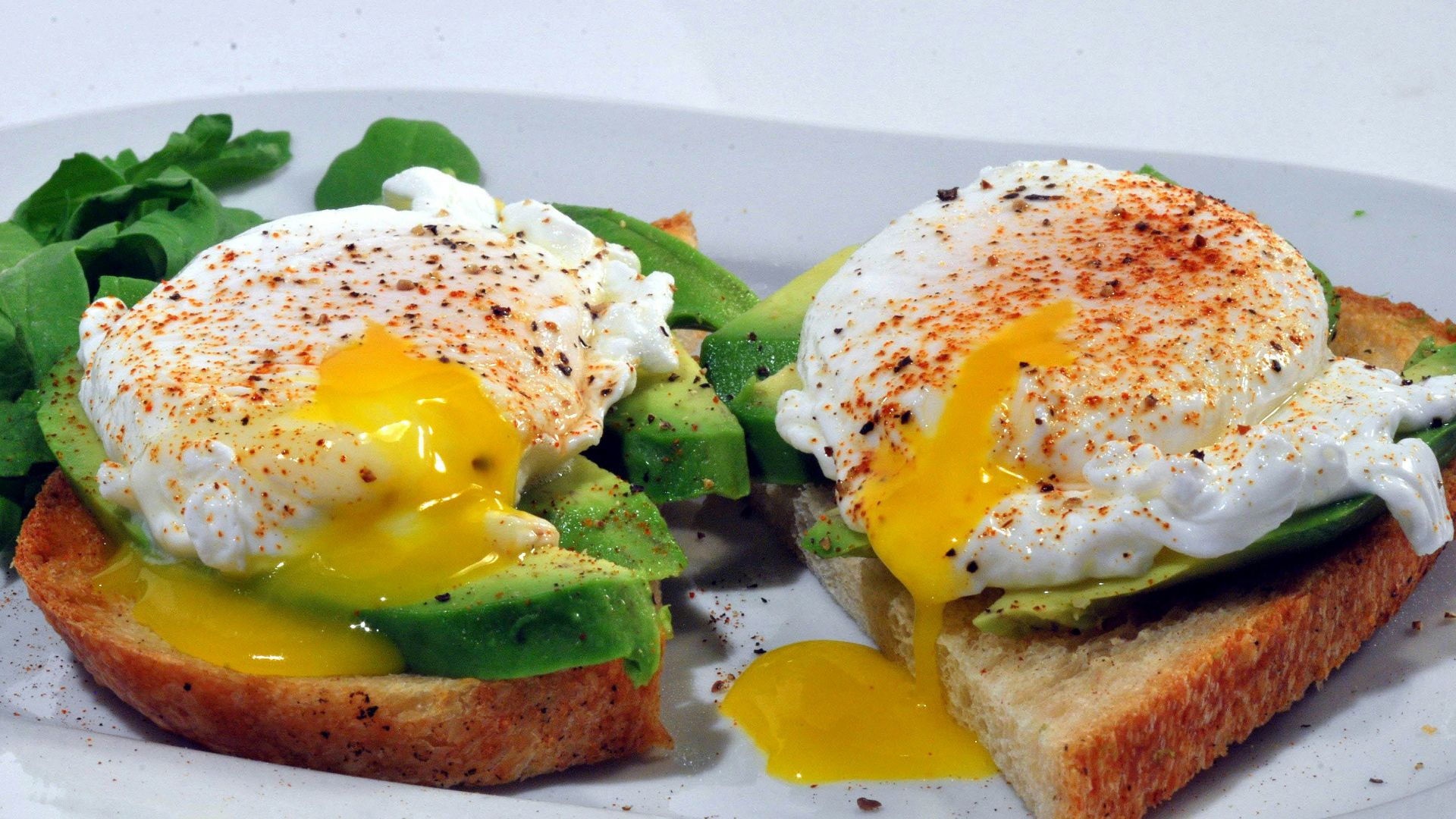 bread with egg and vegetable on white ceramic plate