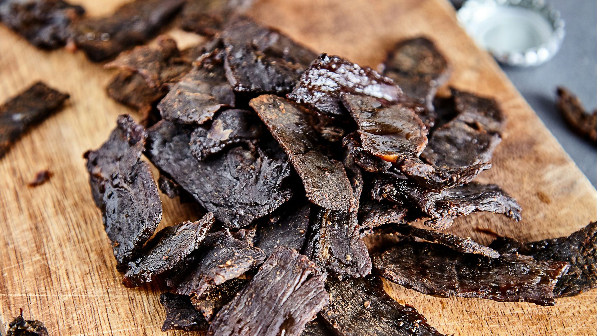 a wood cutting board with brown objects on it