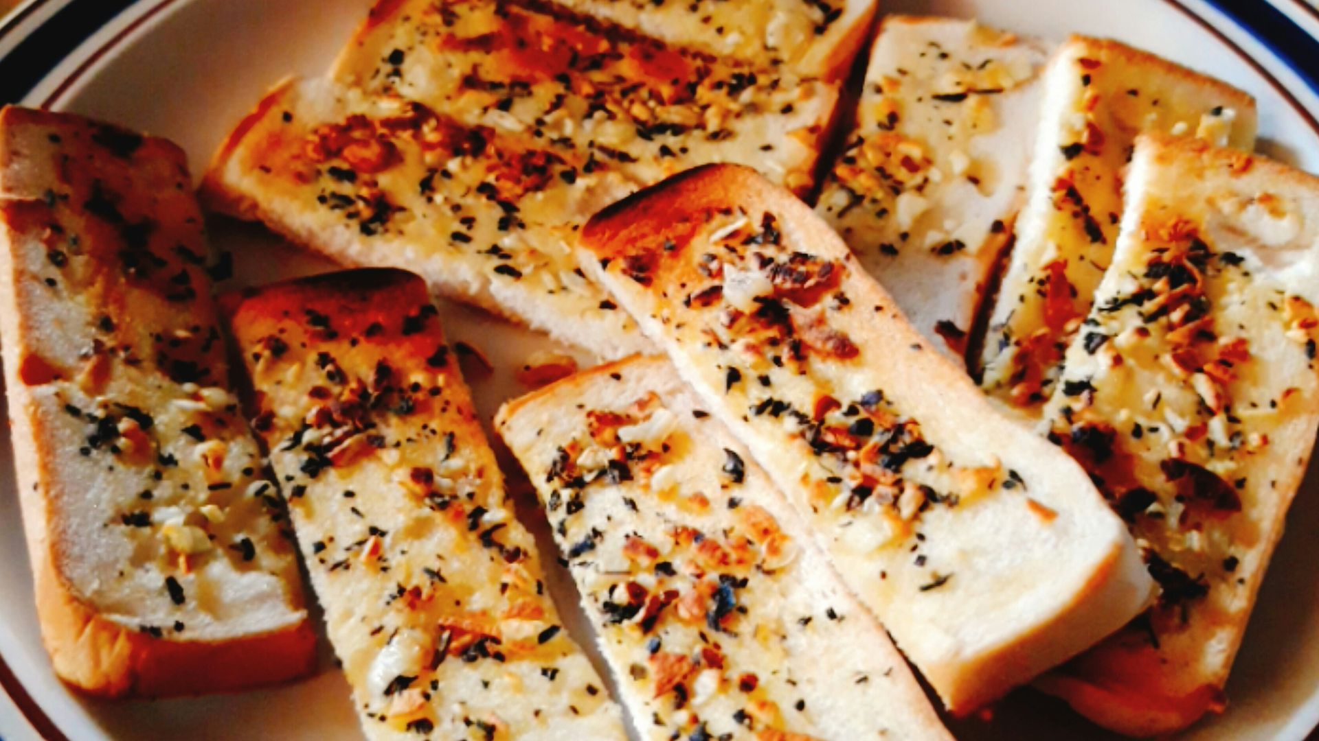 sliced pizza on blue and white ceramic plate