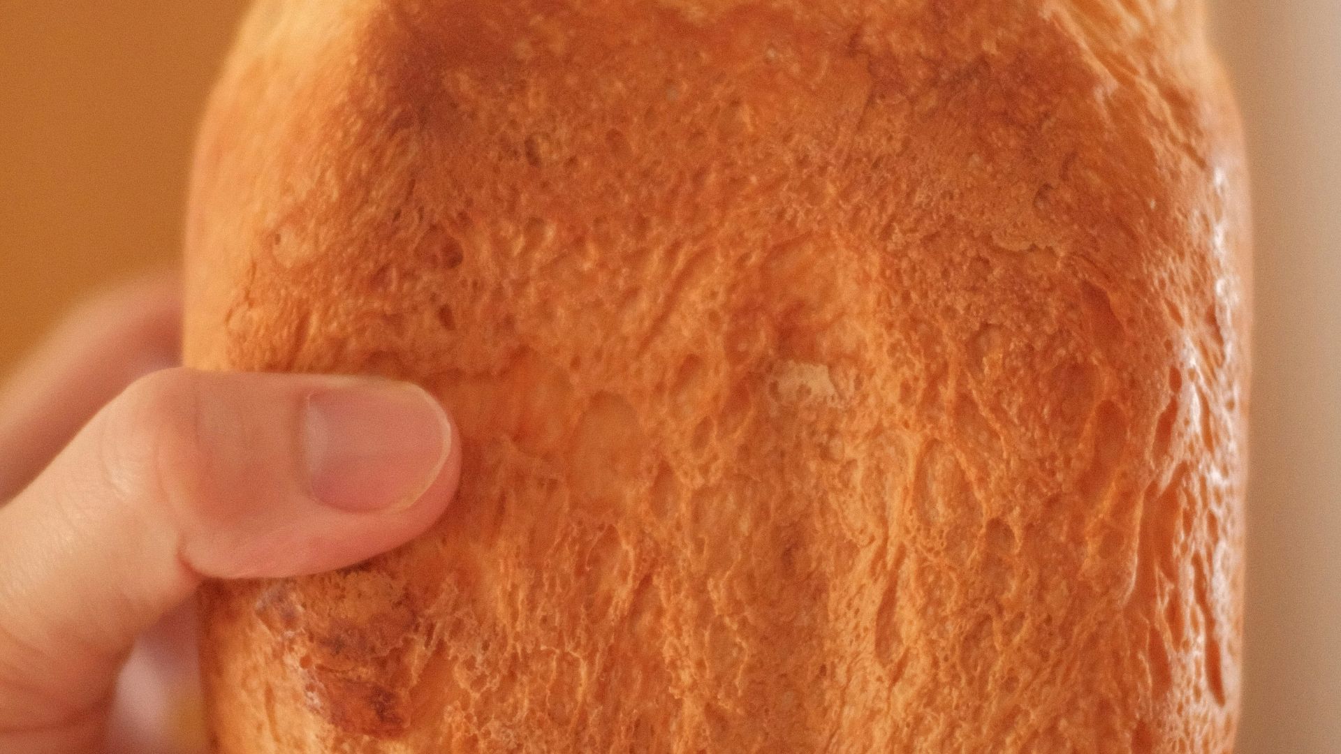 person holding bread with butter