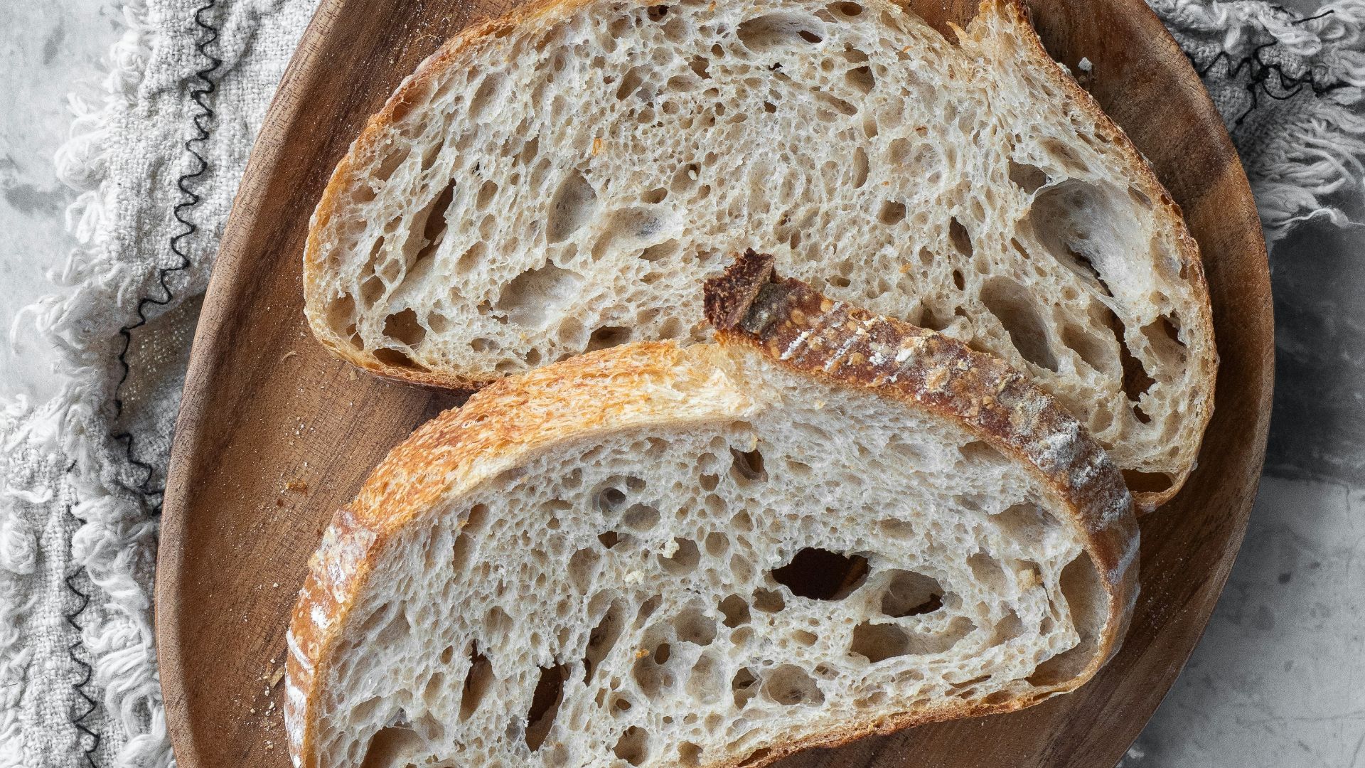 bread on brown wooden round tray