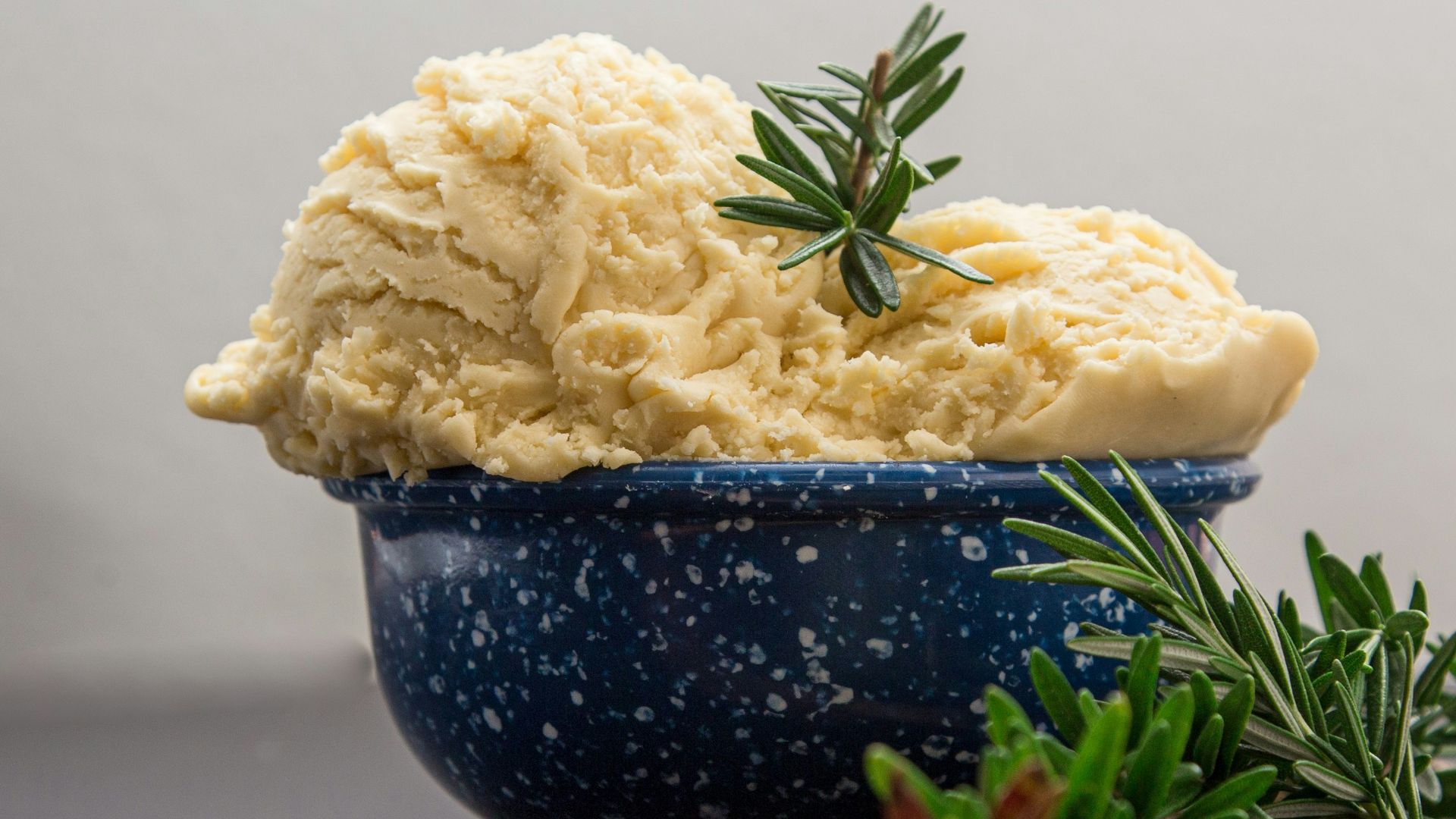 brown wooden spoon on blue ceramic bowl