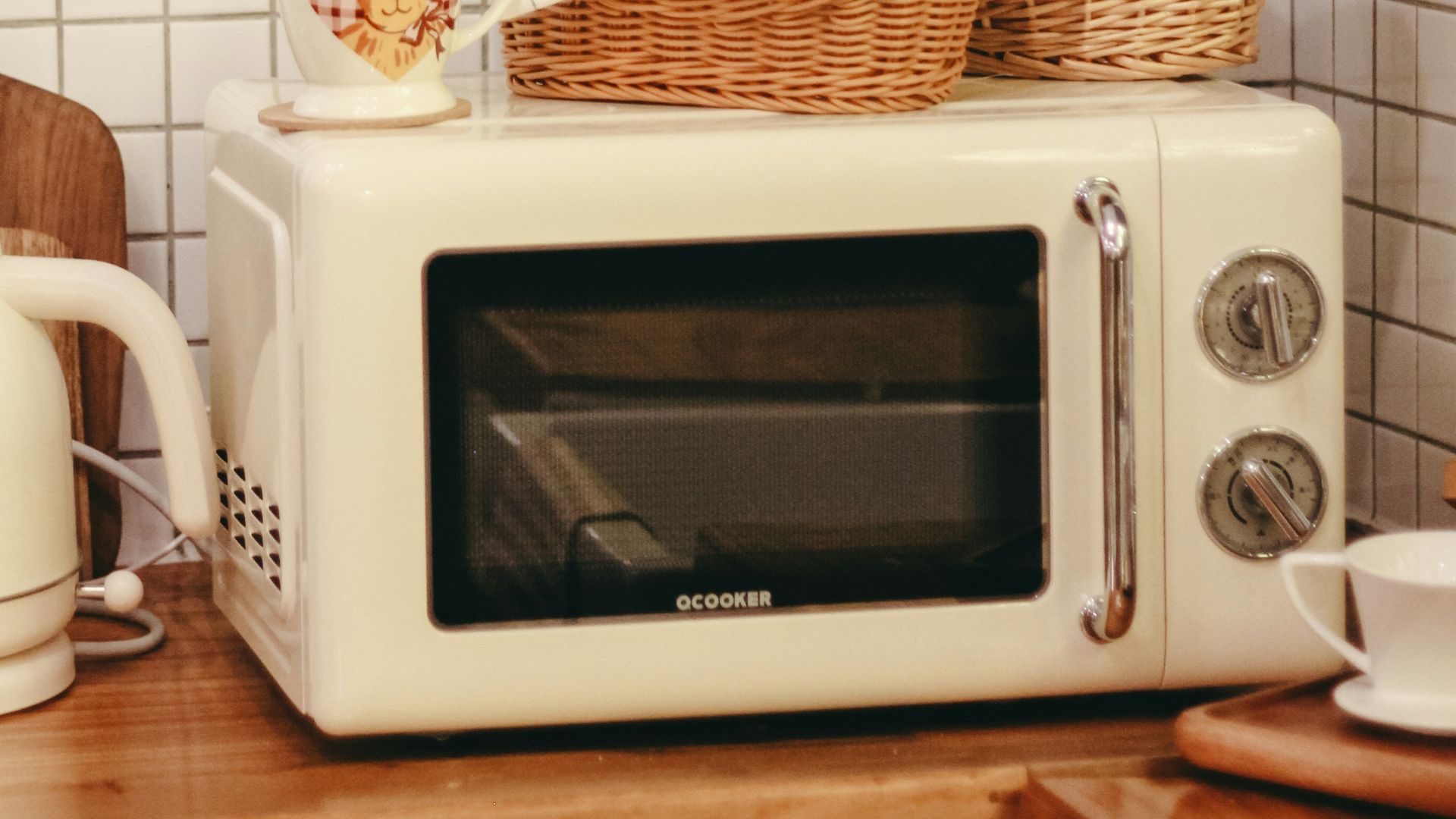 a white microwave oven sitting on top of a wooden counter