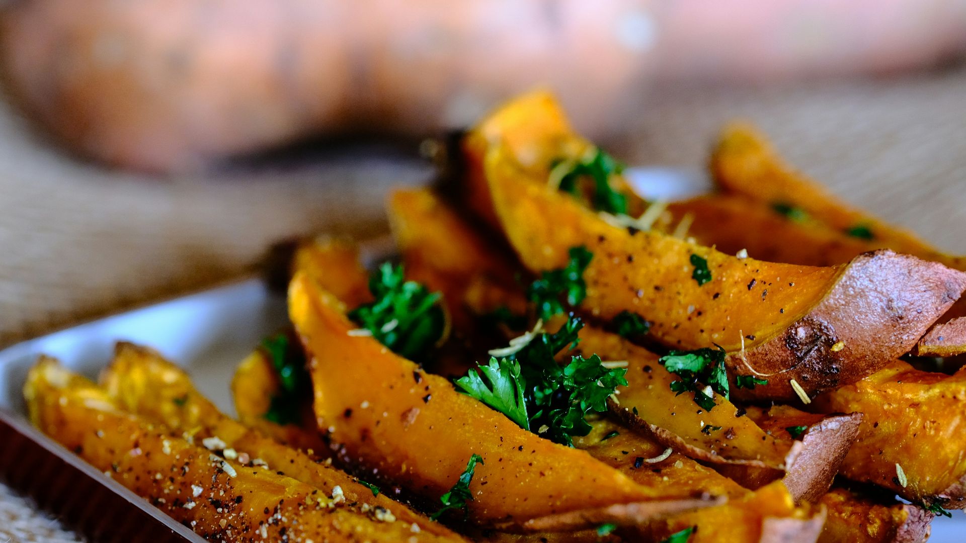 sliced vegetable on brown wooden chopping board