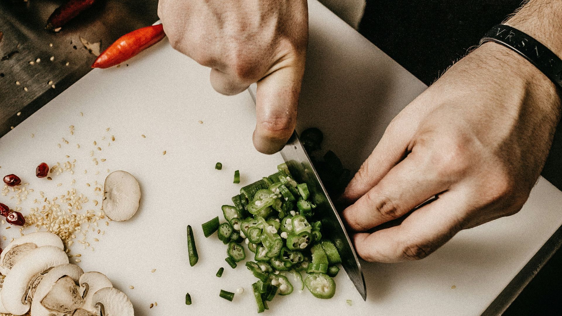person slicing vegetable
