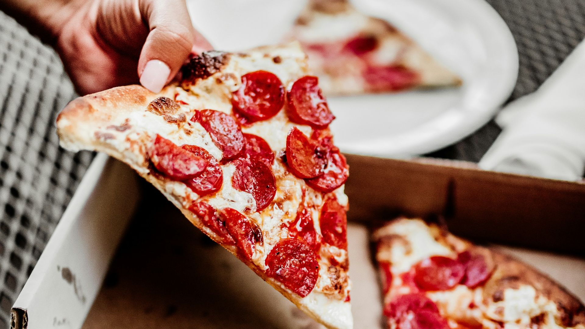 sliced pizza on white ceramic plate