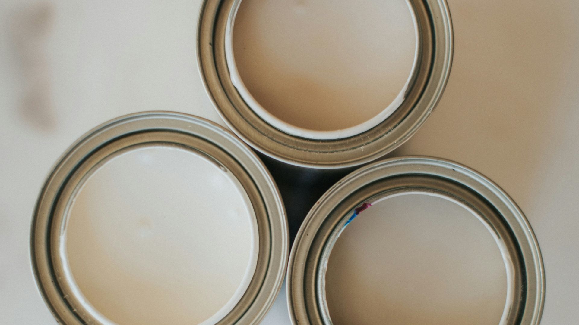 2 round silver and gold colored coins