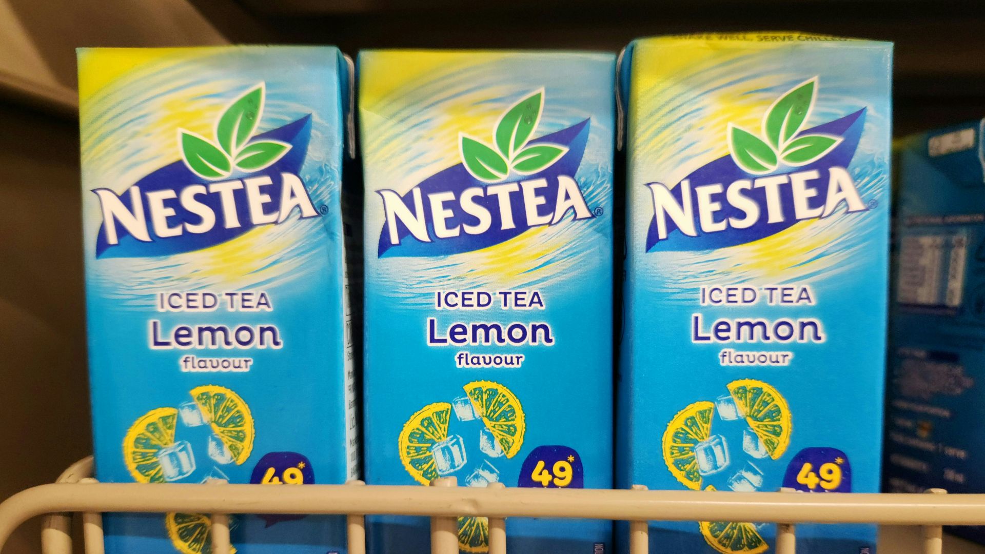Three boxes of nestea lemon iced tea.