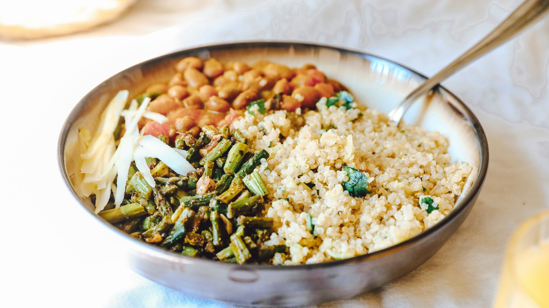 cooked rice with green peas and carrots on stainless steel bowl