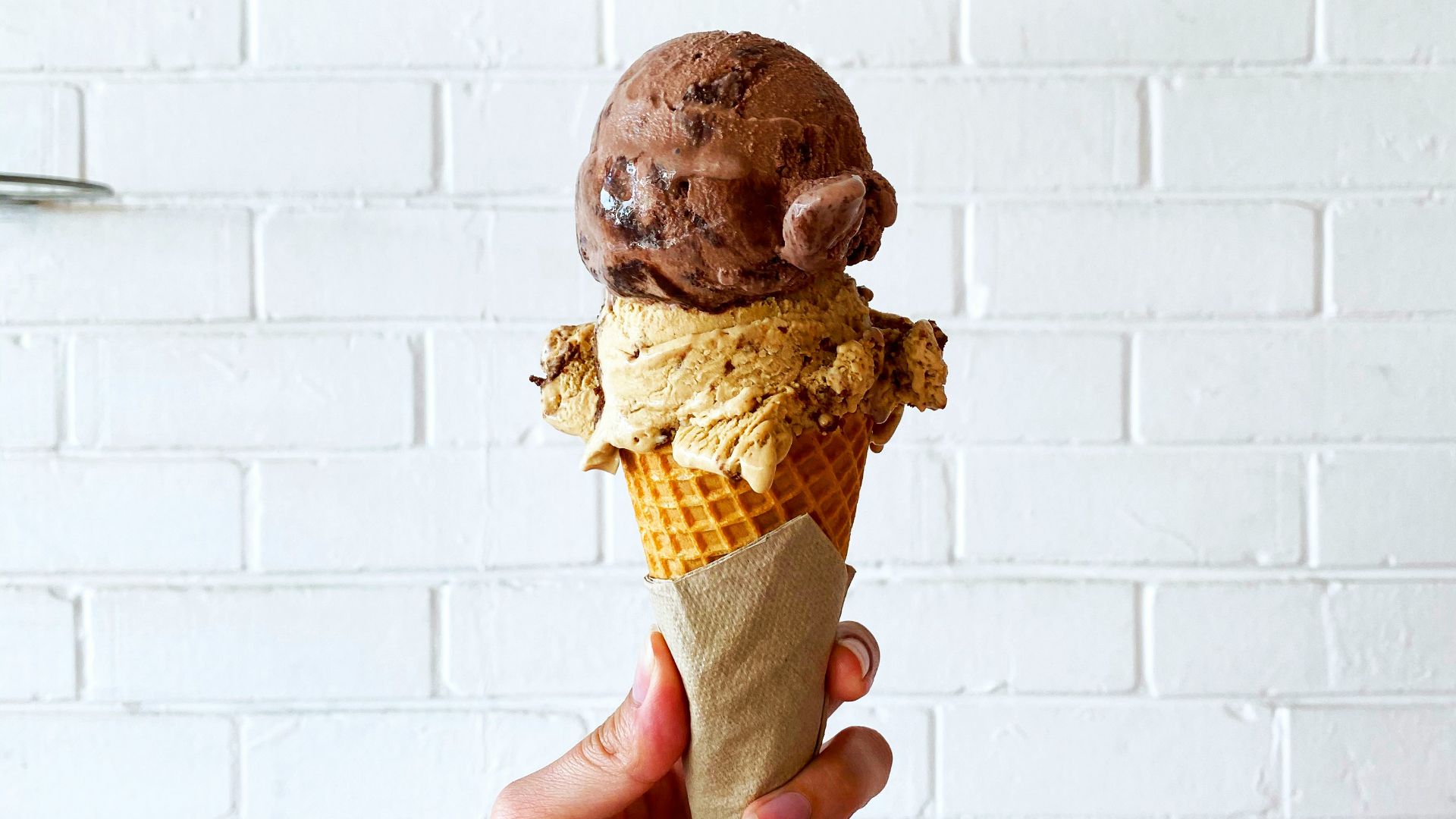 person holding ice cream cone