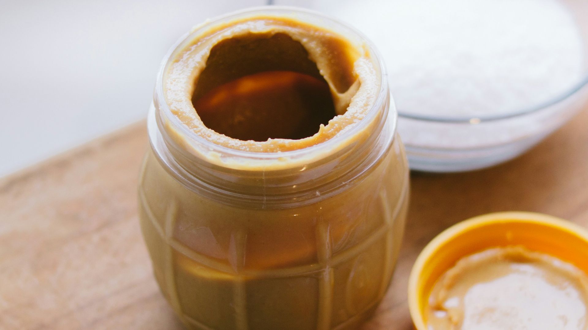 peanut butter jar on cutting board
