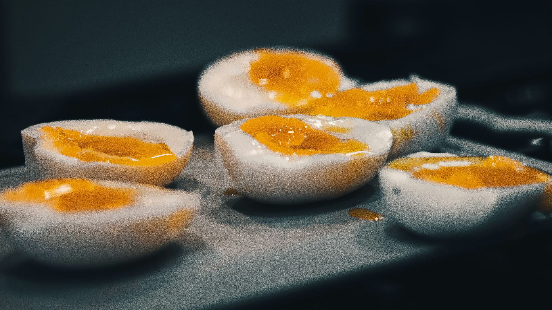 hard boiled eggs are sitting on a tray