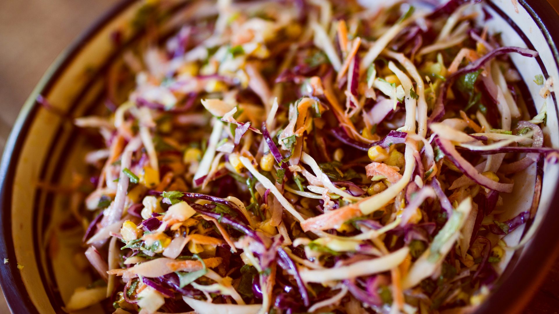 vegetable salad on white and black ceramic bowl