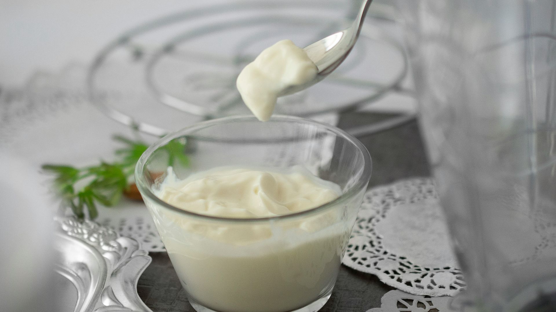 close-up photo of white cream in clear shot glass
