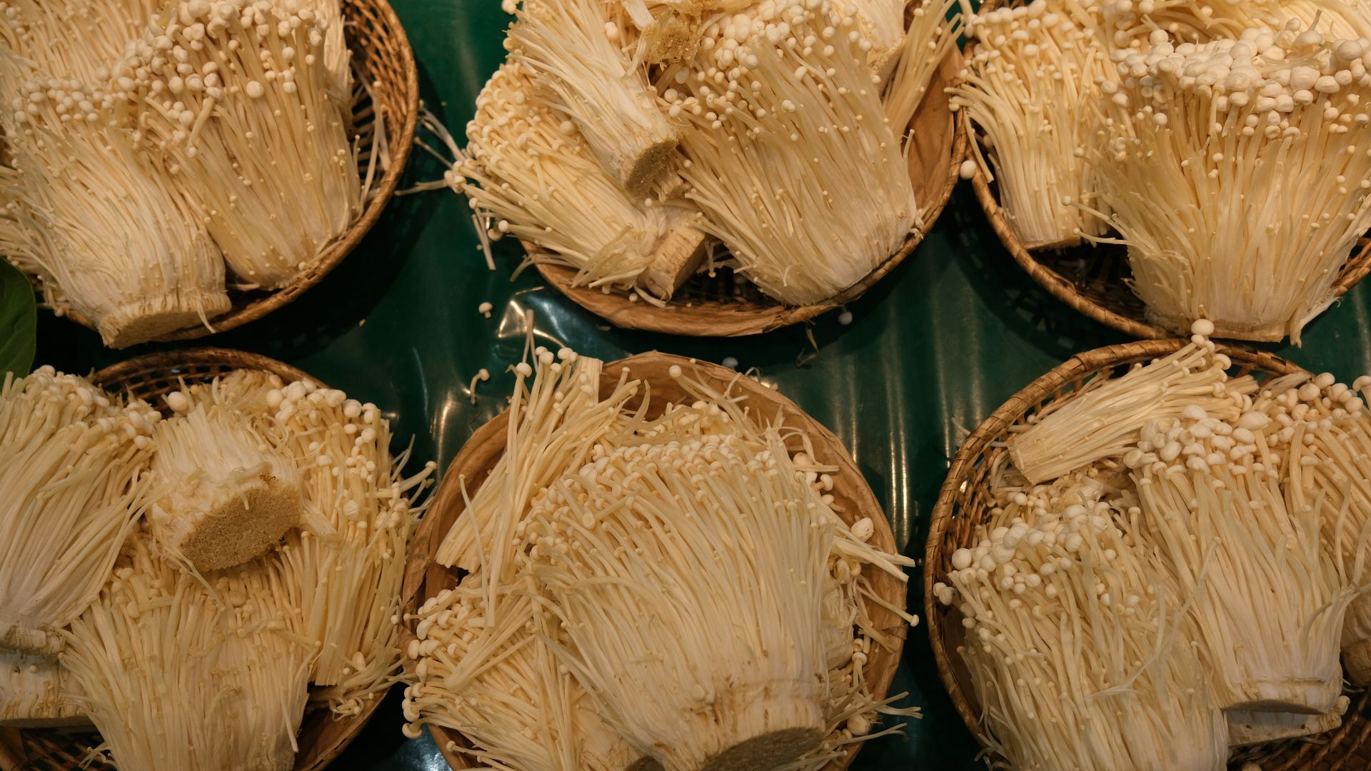 a bunch of baskets filled with food on top of a table