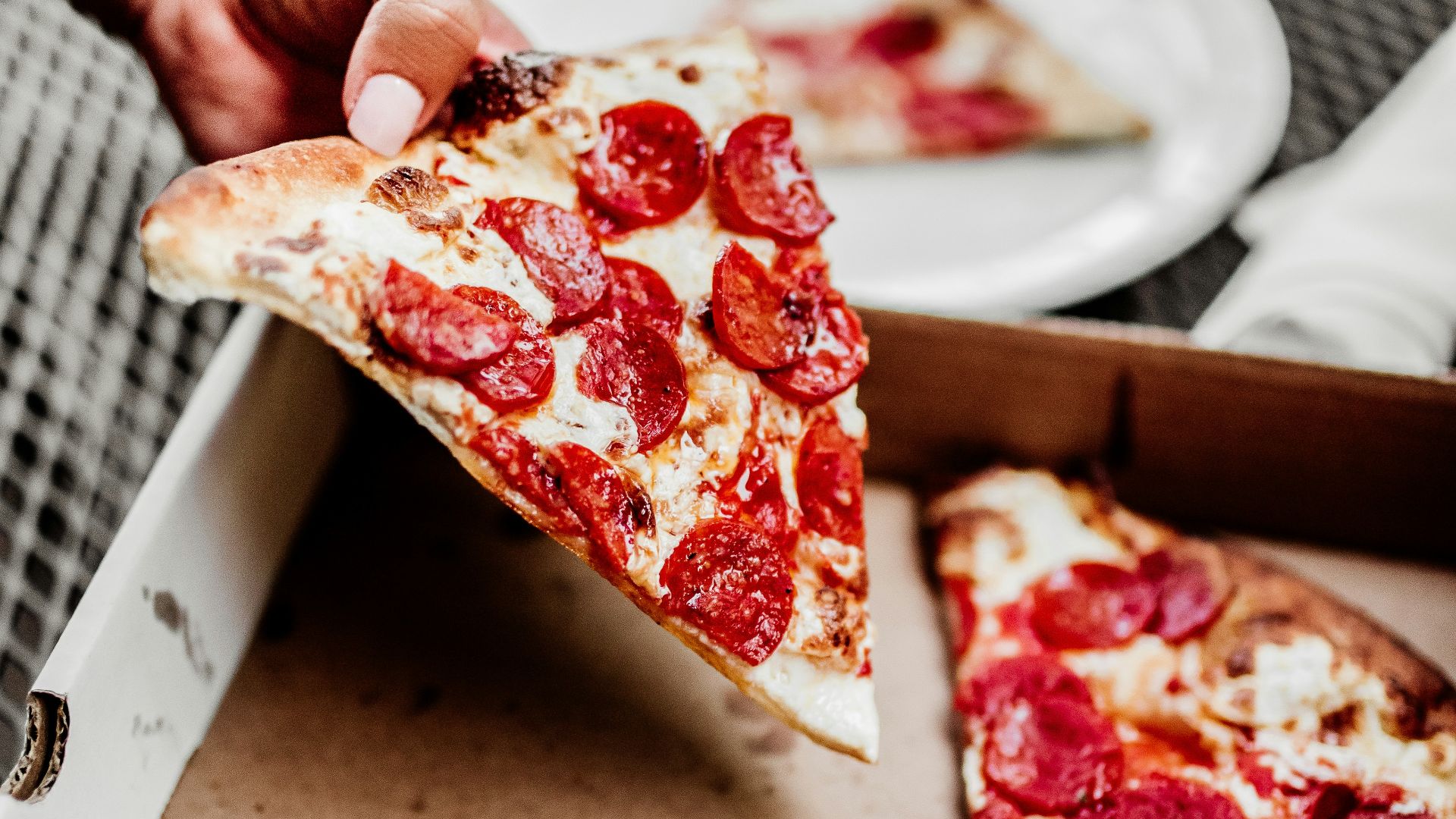 sliced pizza on white ceramic plate