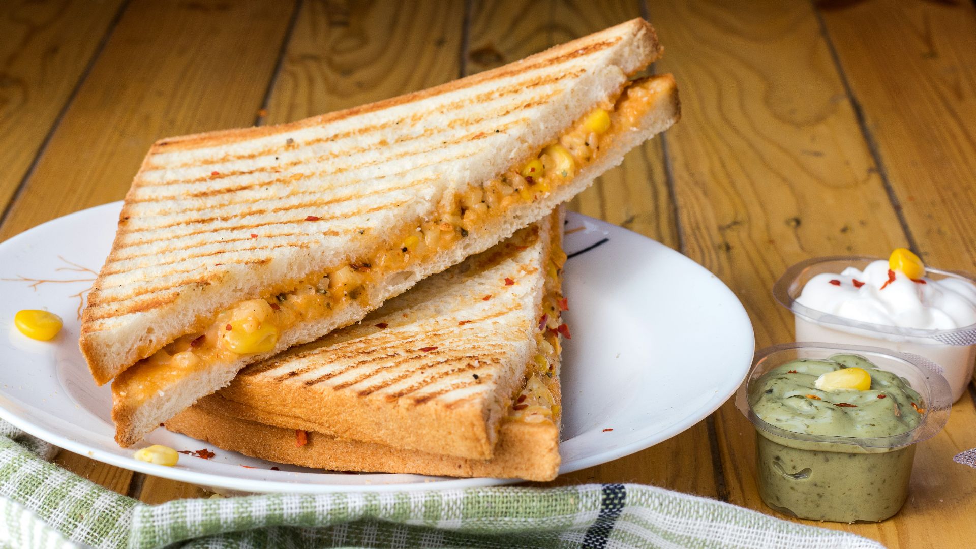 bread with cheese fillings on white ceramic plate