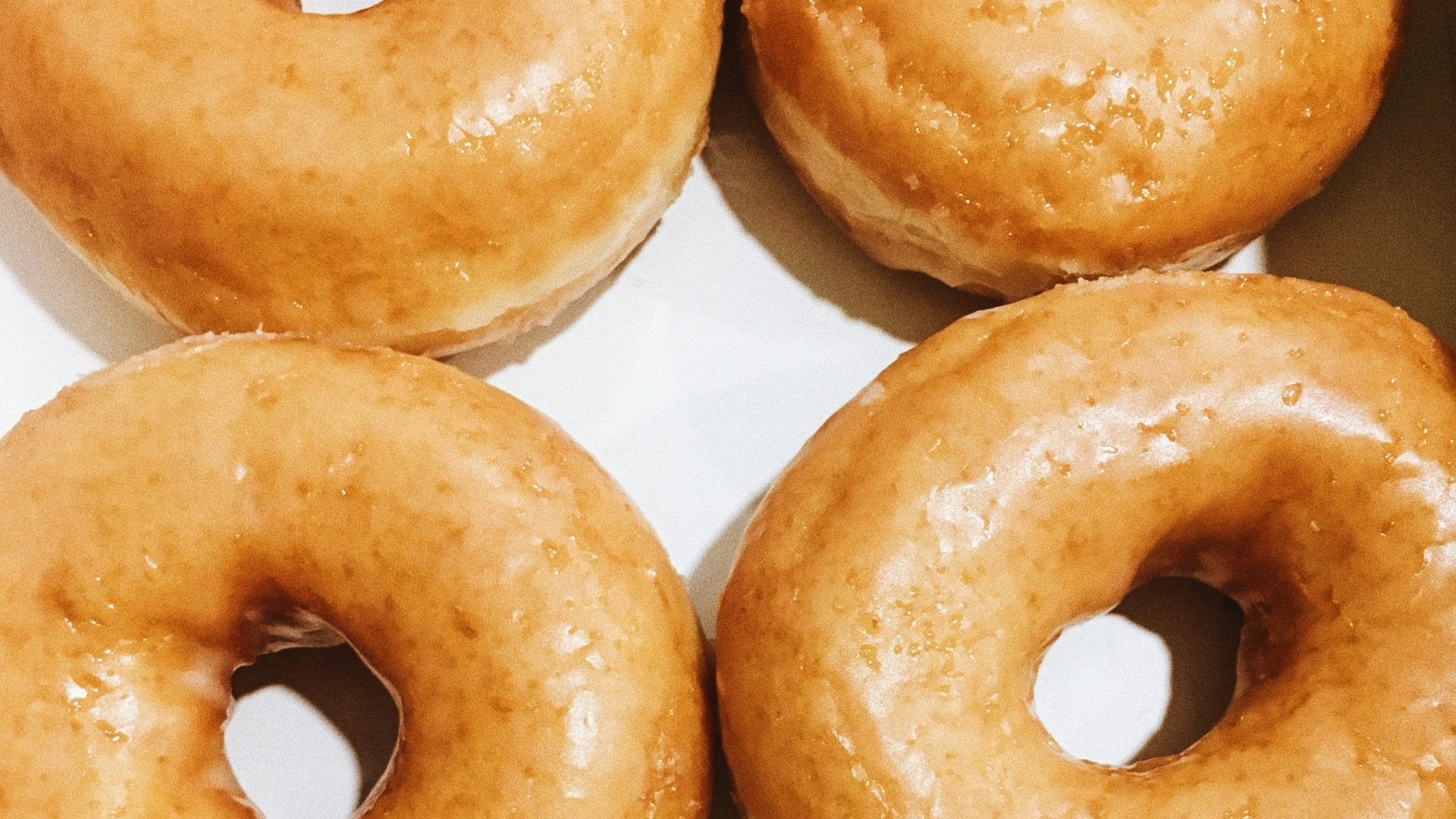 brown donuts on white paper