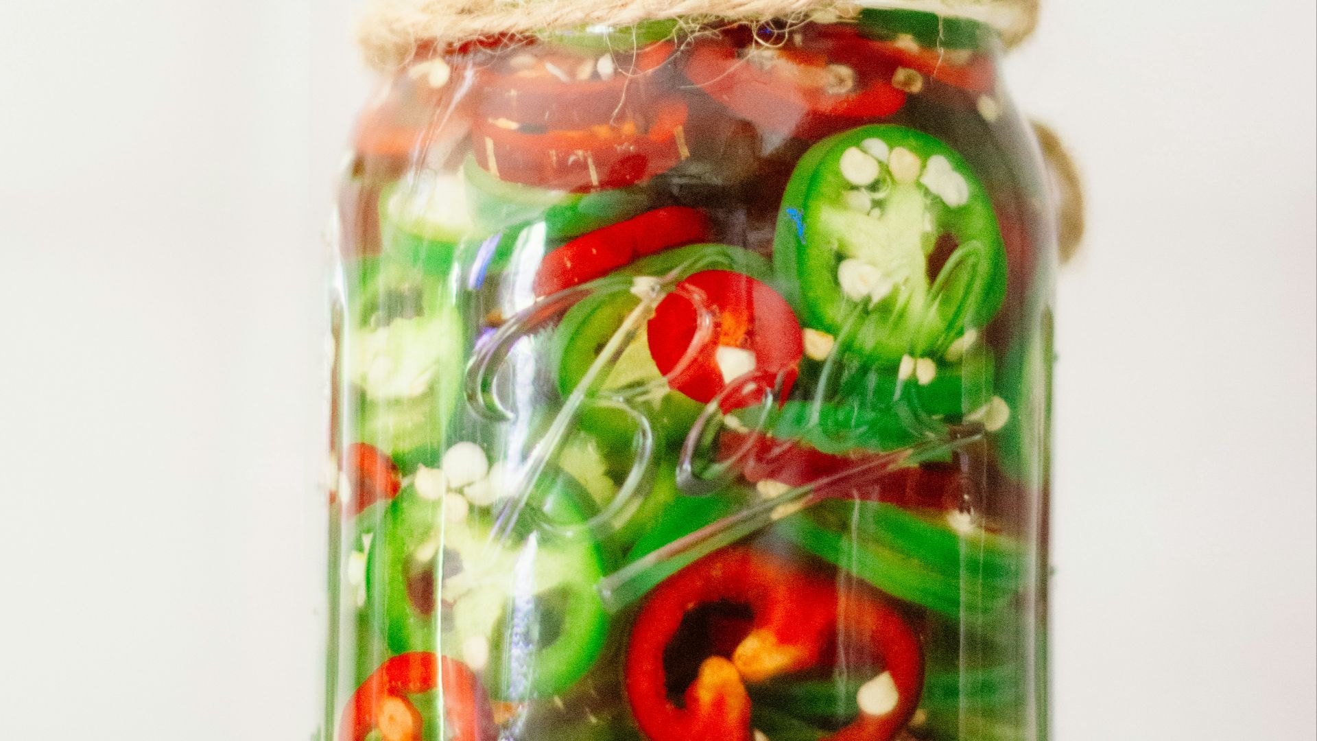 a jar filled with lots of different types of vegetables
