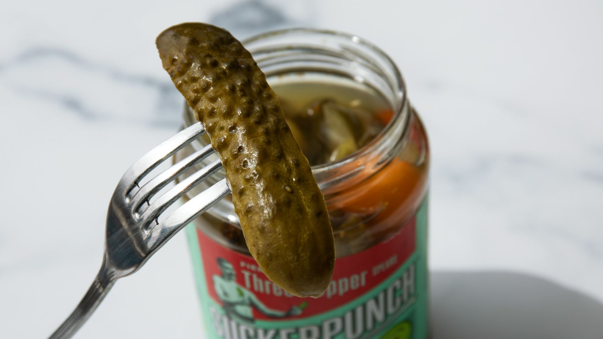 stainless steel fork on green labeled can