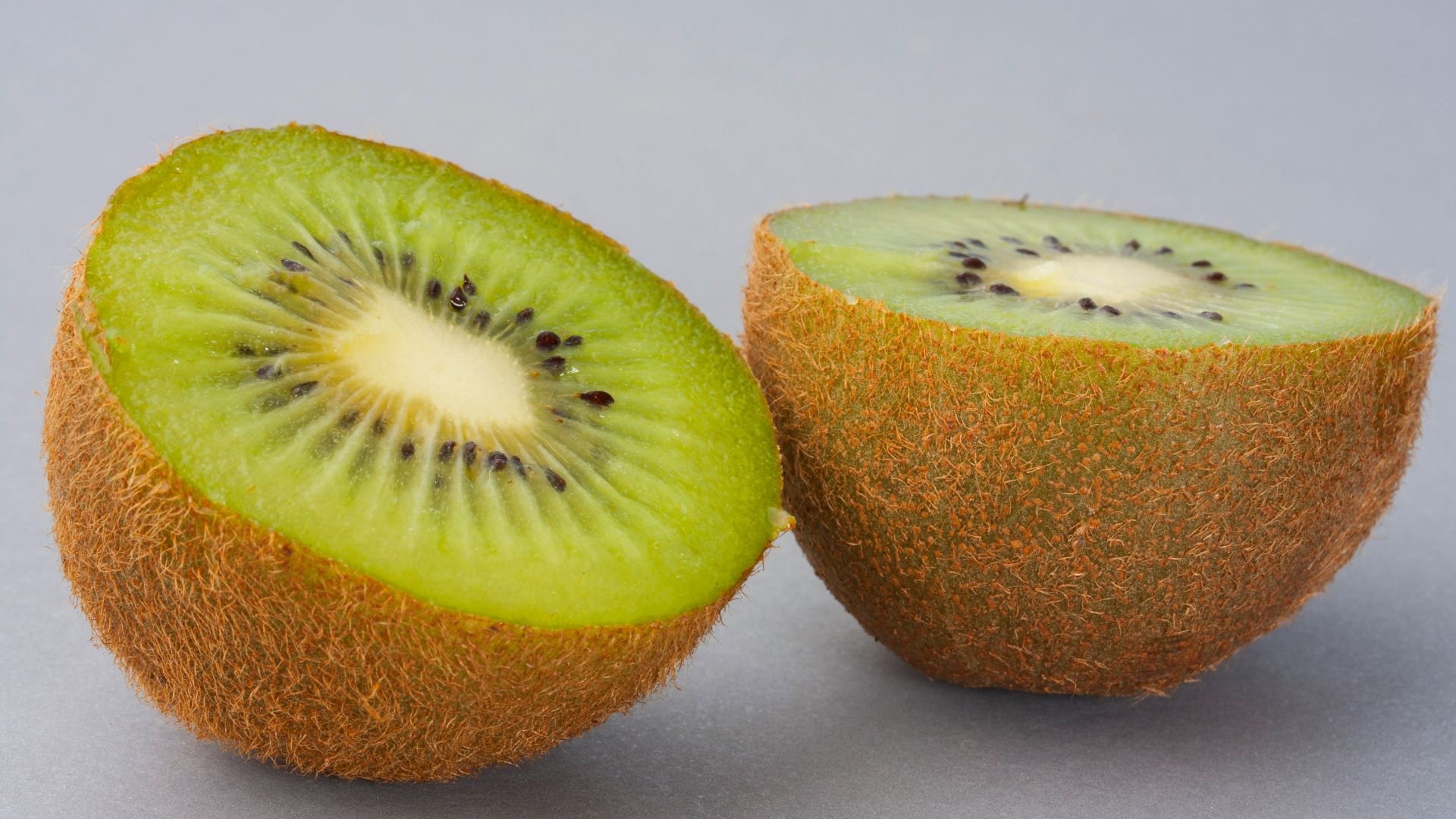 sliced green fruit on white surface