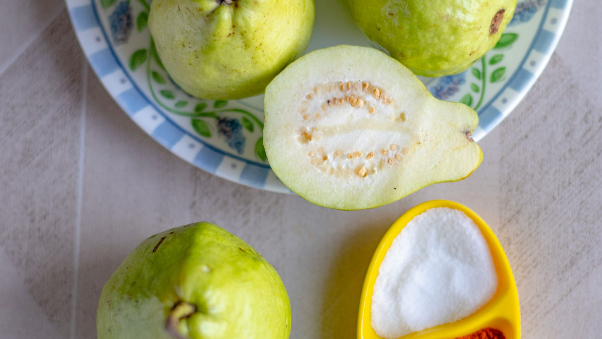 green apple fruit on white and blue ceramic plate