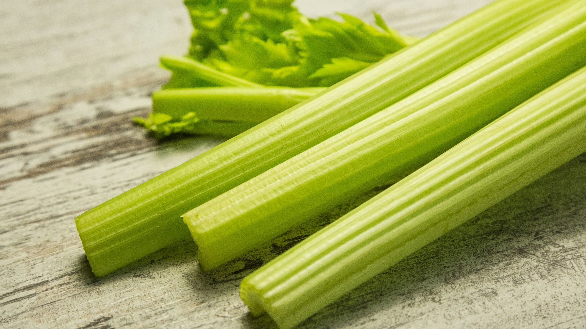 green vegetable on gray wooden table