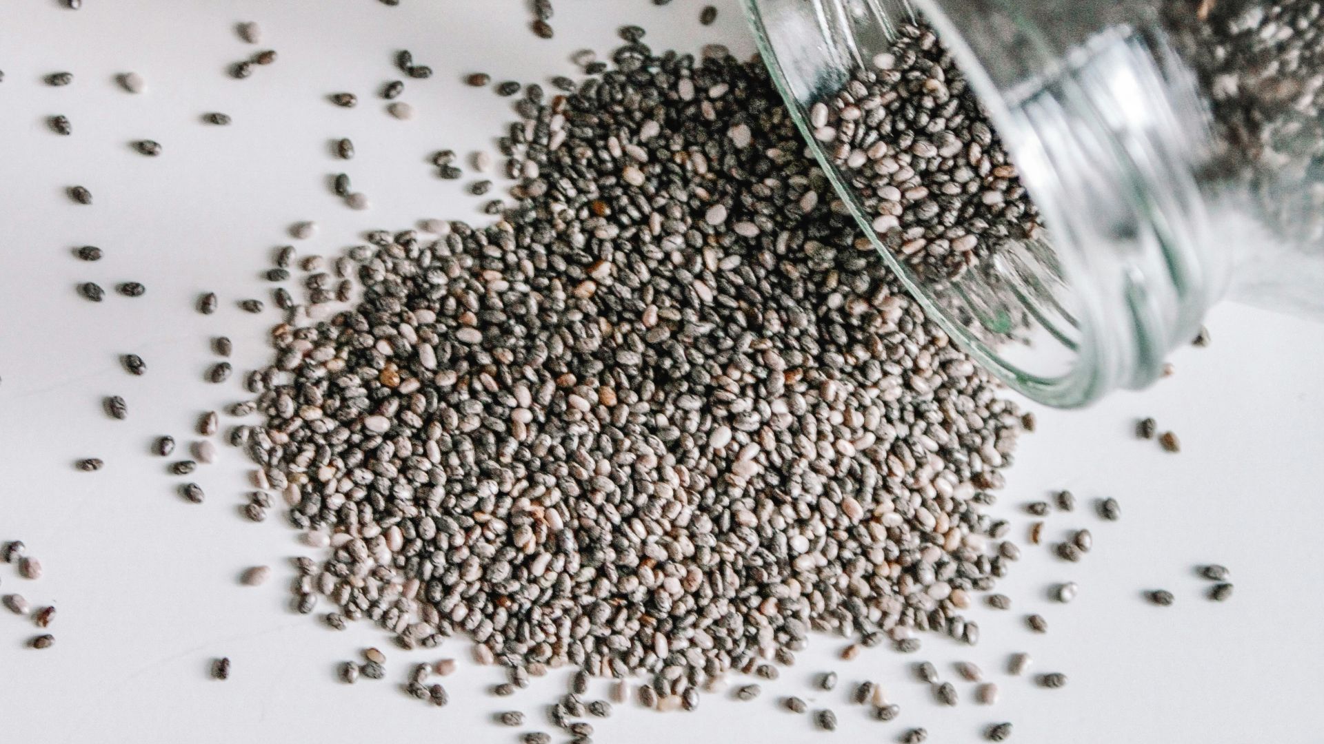 black beads in clear glass jar