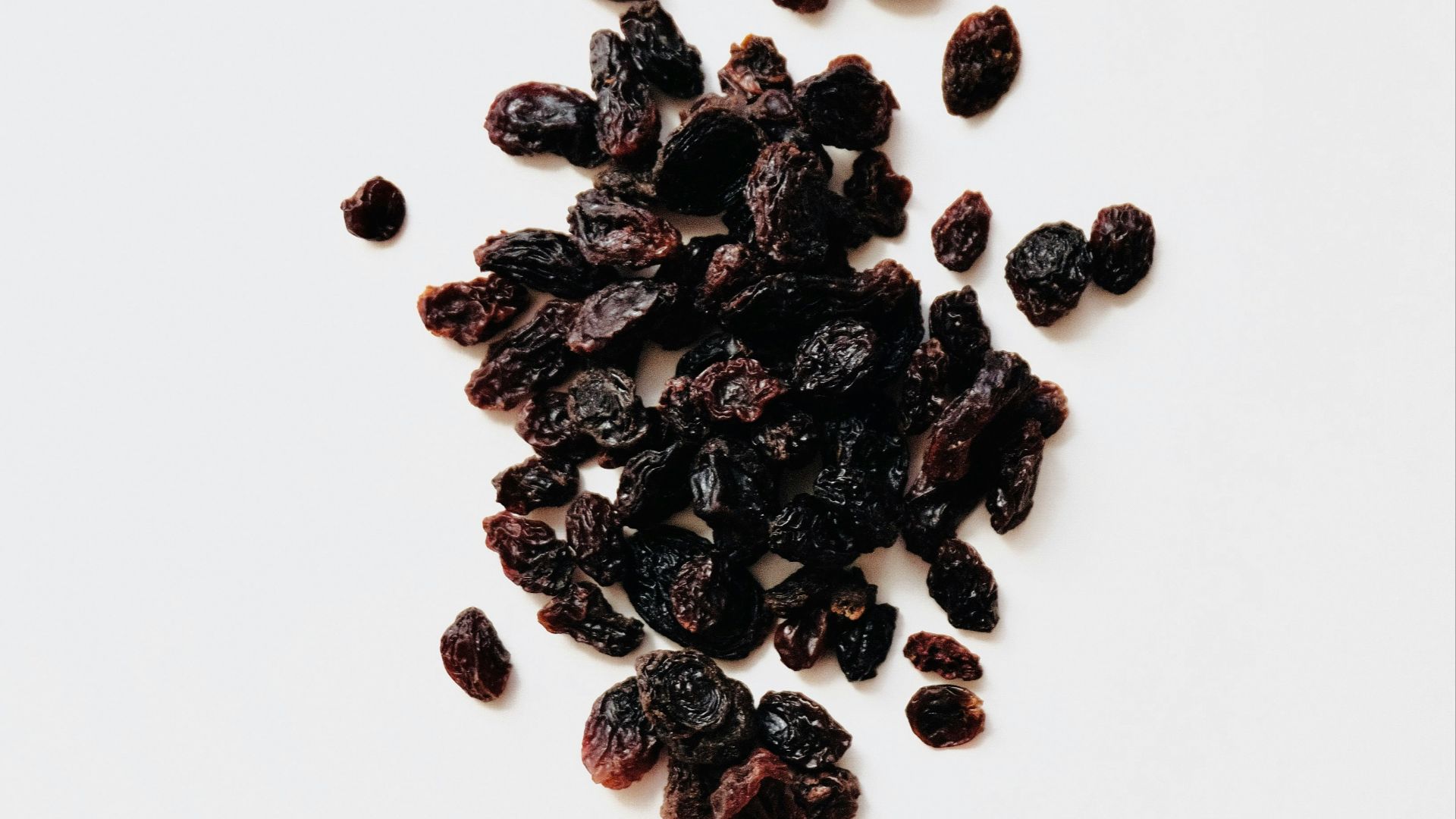 black round fruits on white background