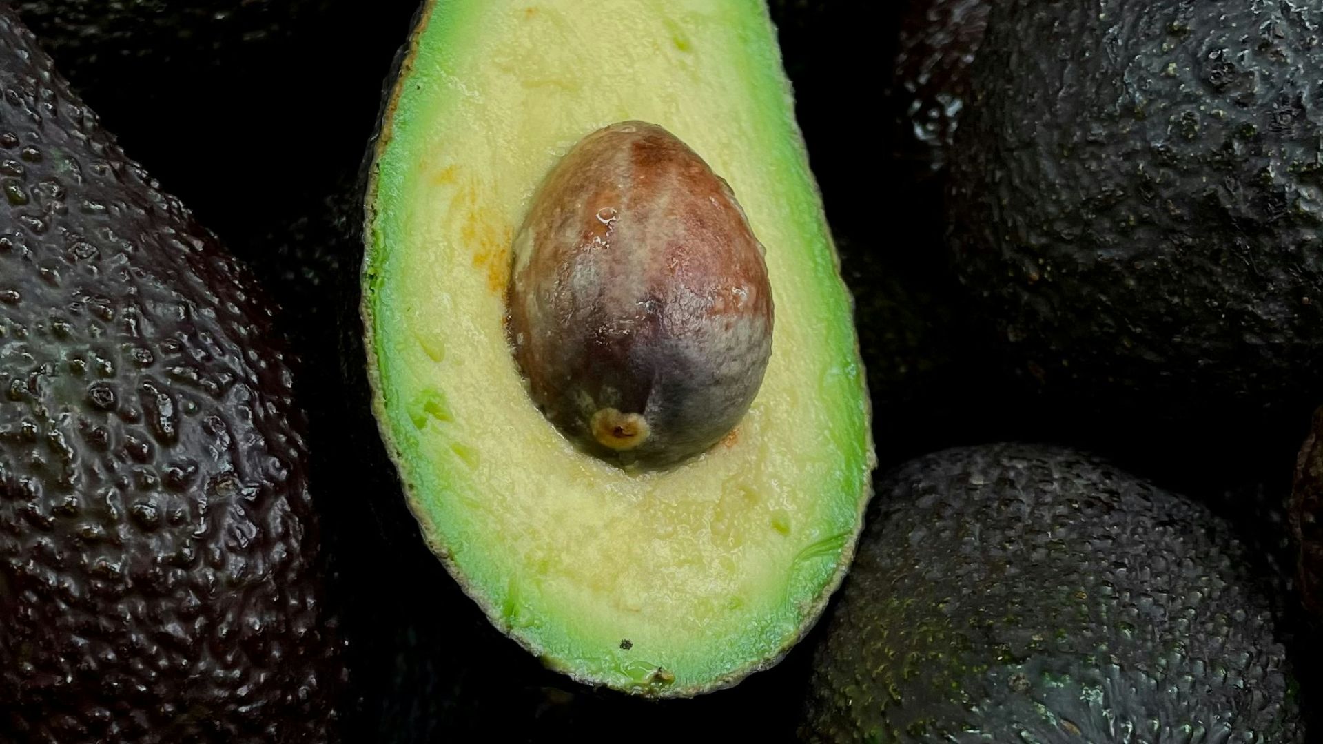 green and brown fruit on black and brown fruits