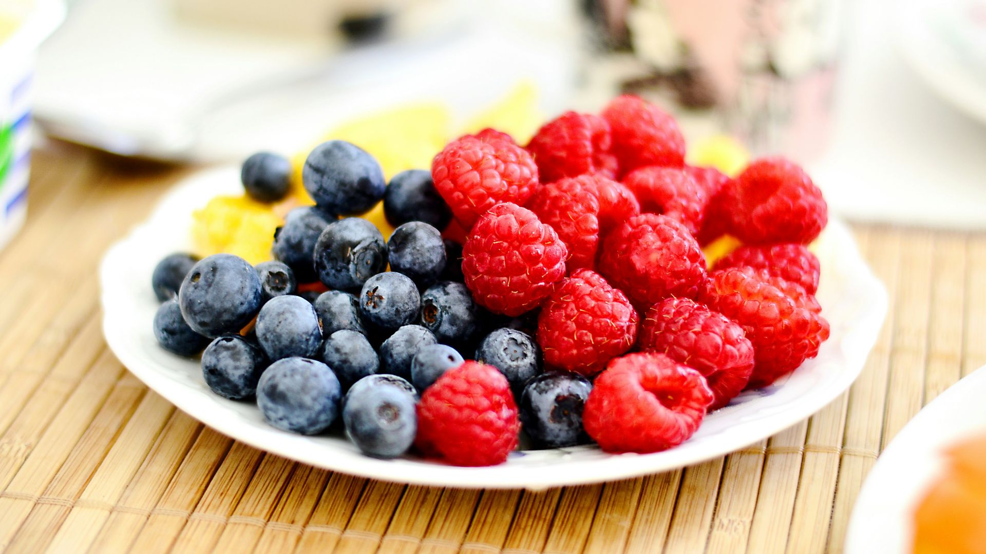 strawberries and blue berries on palte