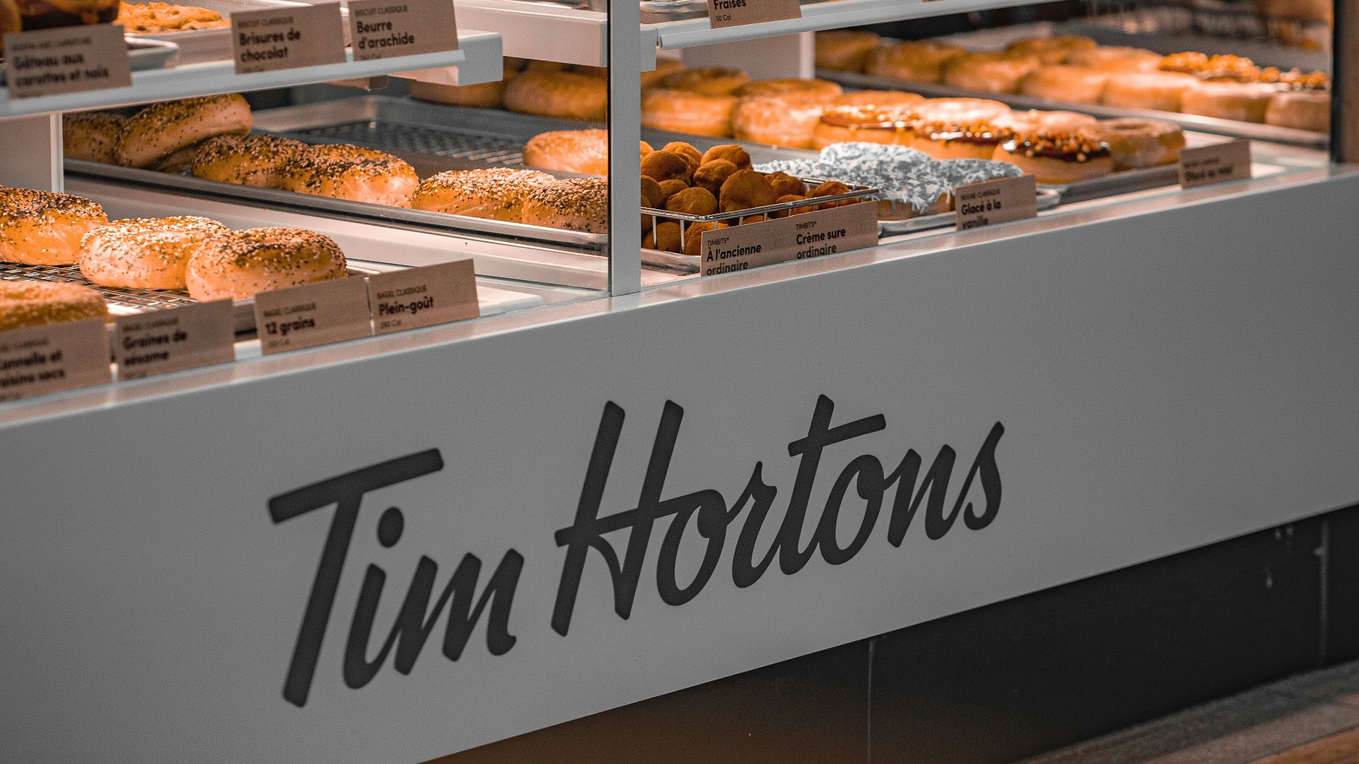 a display case filled with lots of donuts