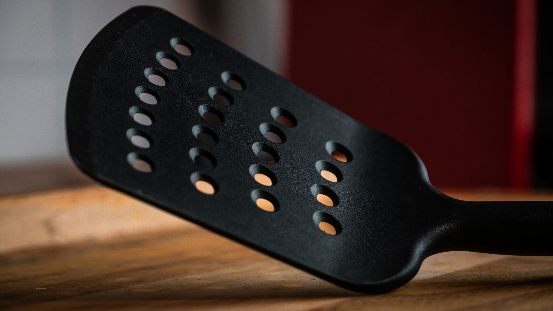 black plastic chair on brown wooden table