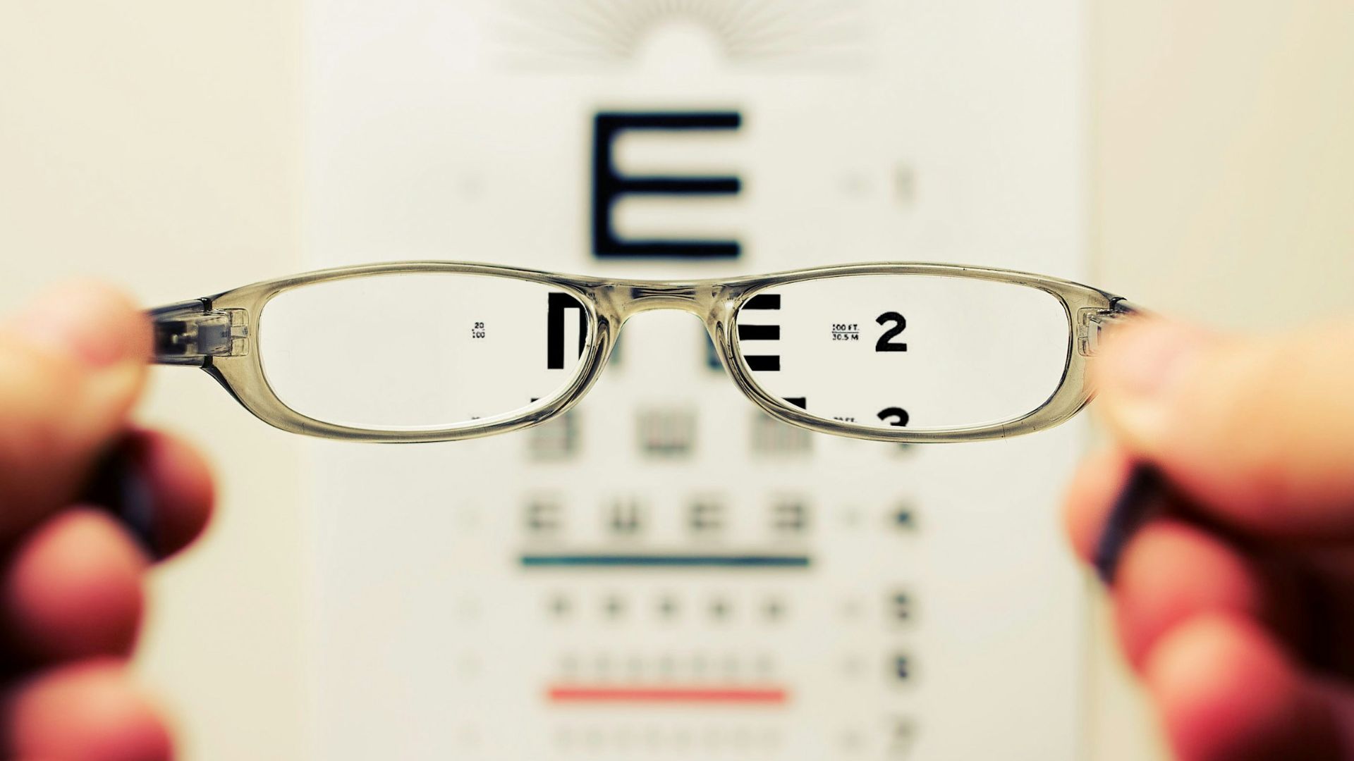 person holding eyeglasses