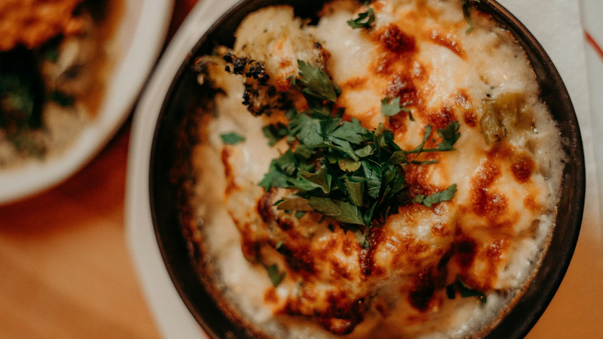 a close up of a bowl of food on a table
