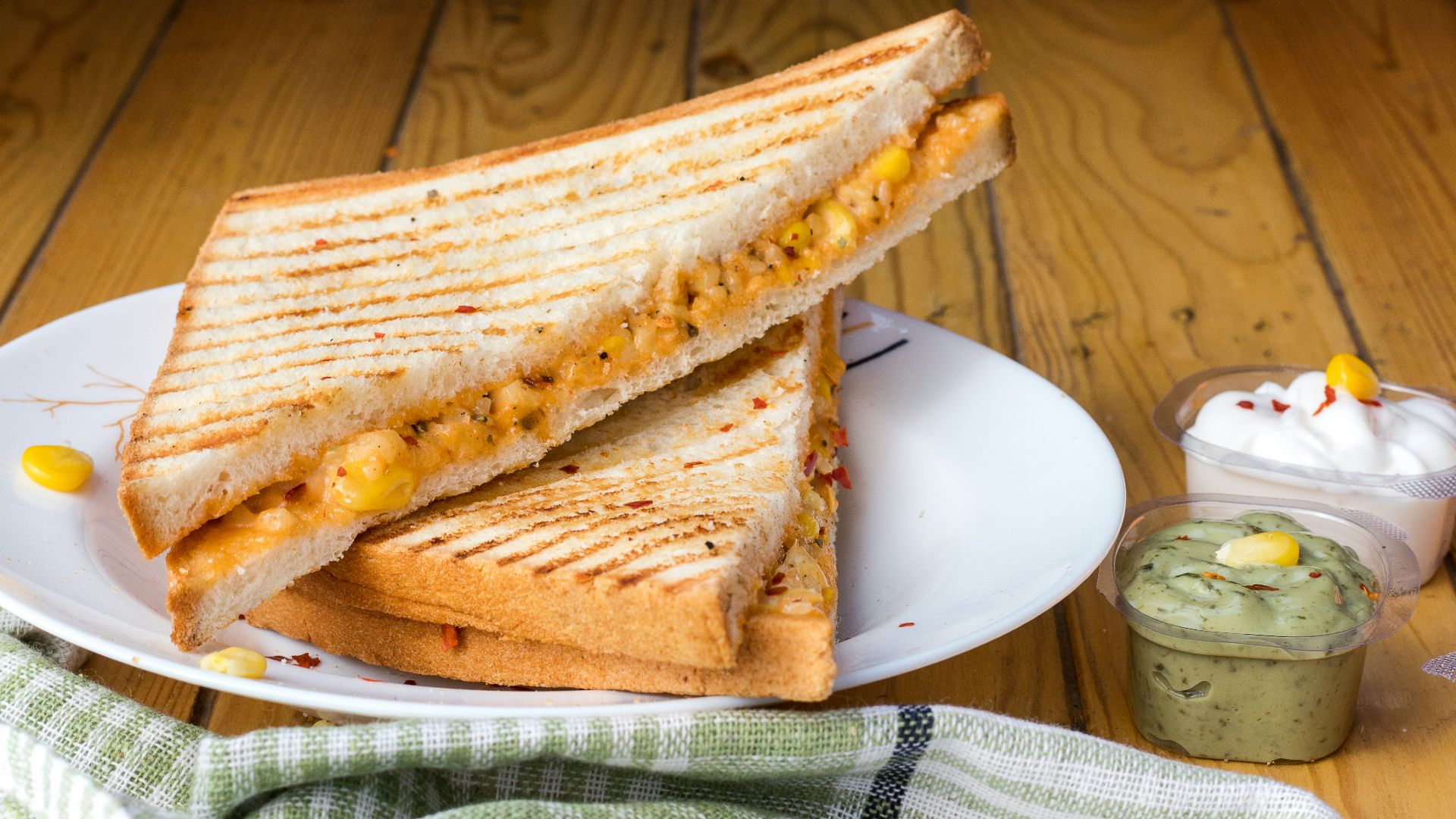 bread with cheese fillings on white ceramic plate