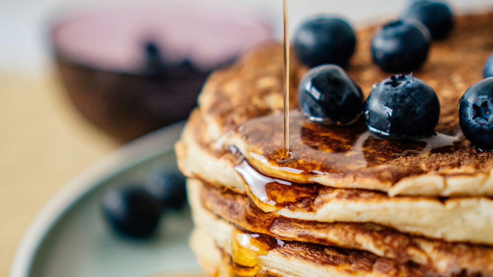 pancakes with blueberries on white ceramic plate