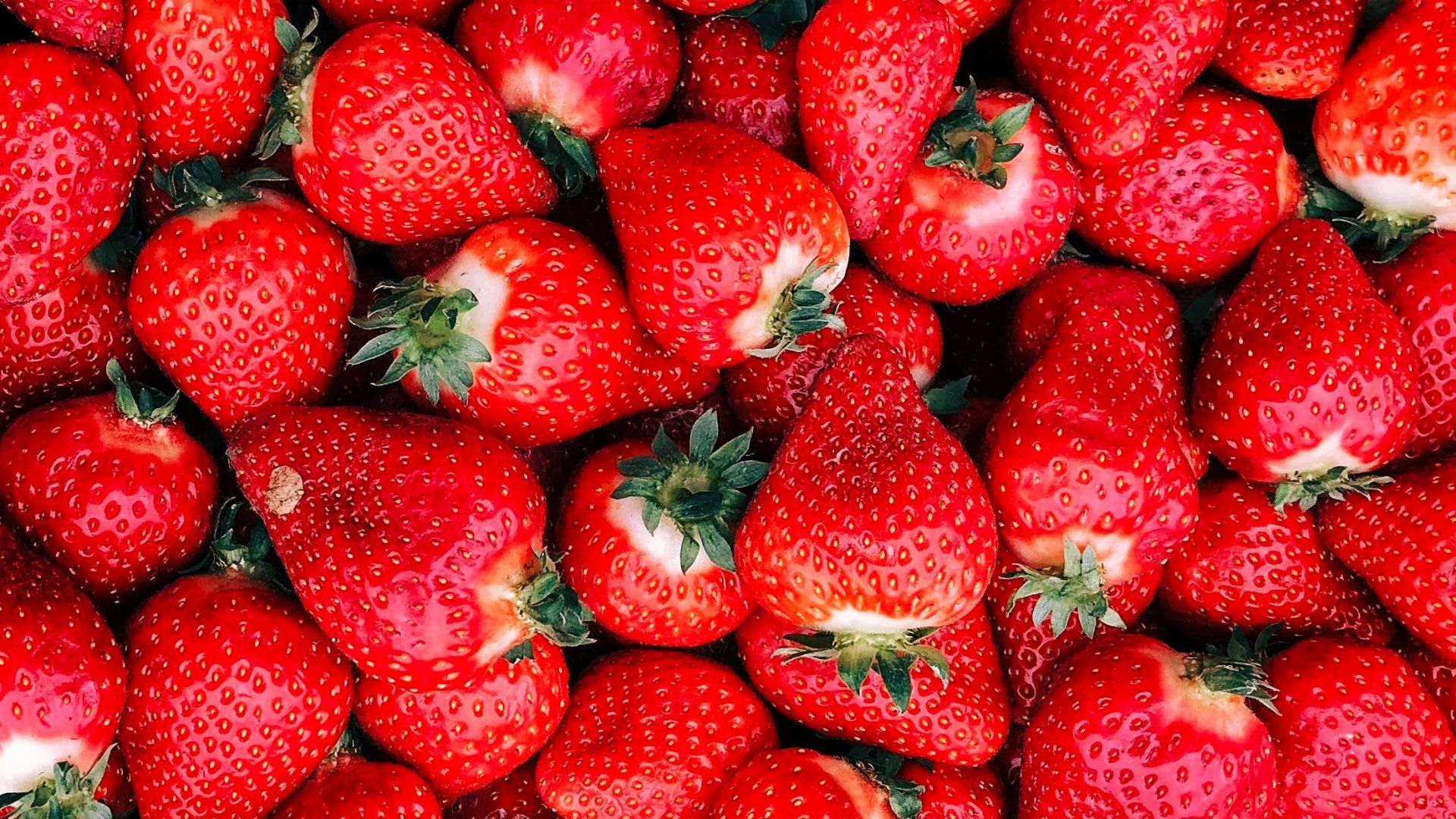 red strawberries on white ceramic plate