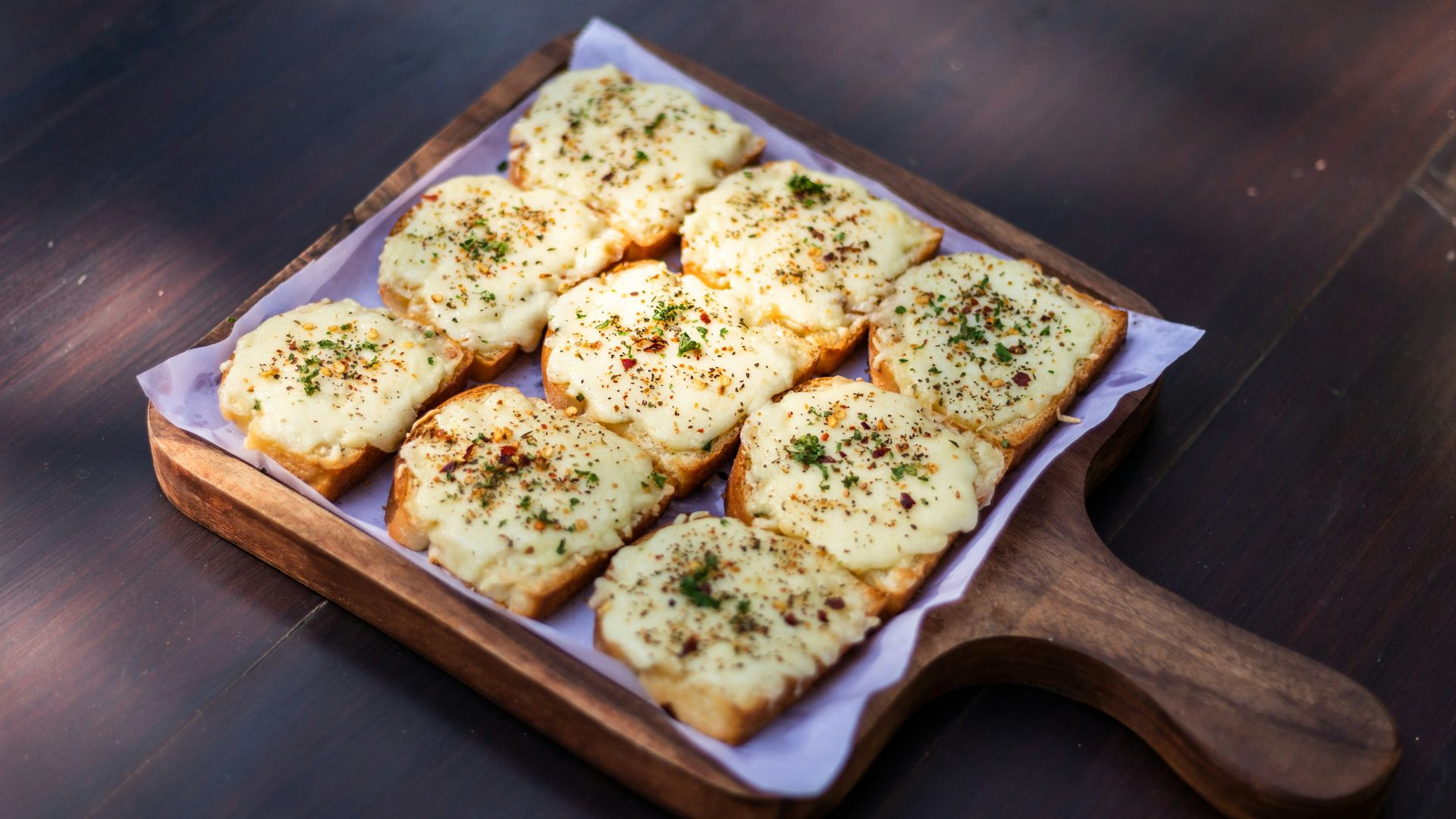 brown and white bread on brown wooden tray