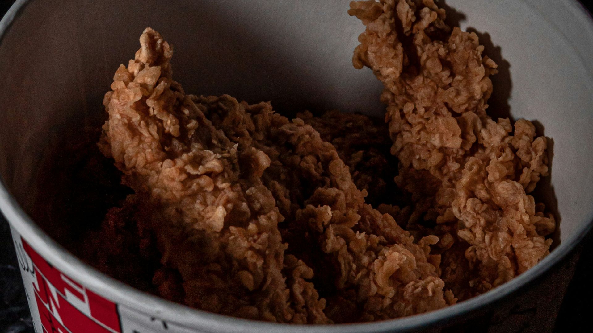 a bowl filled with fried food on top of a table