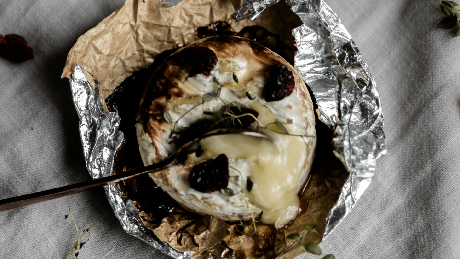 brown and white pastry on white textile