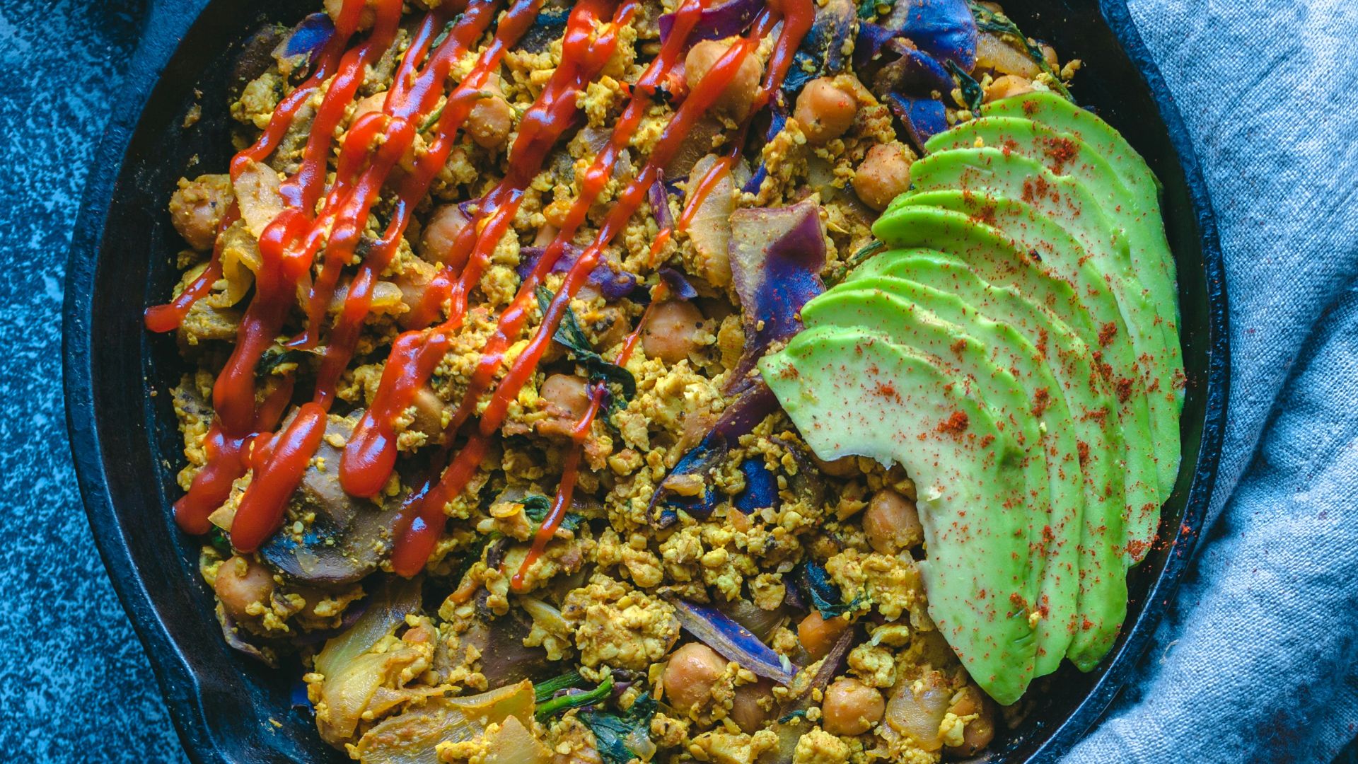 a bowl of food on a table with a spoon