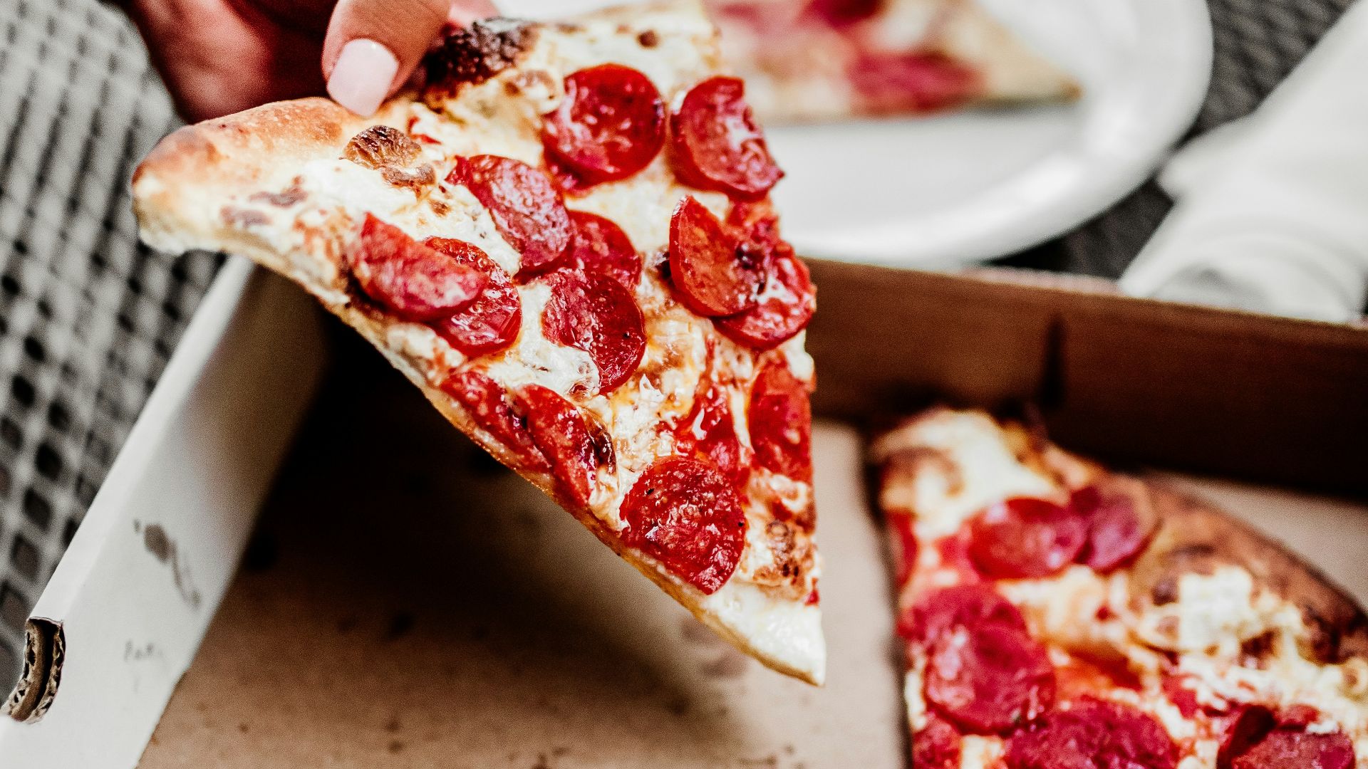 sliced pizza on white ceramic plate