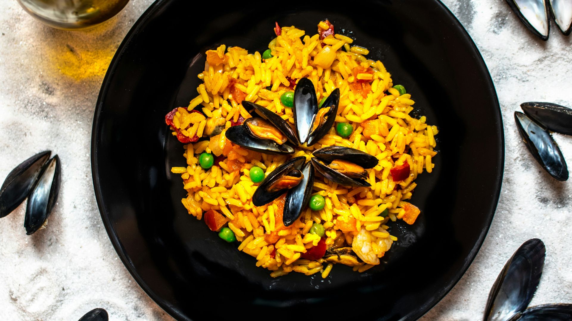 yellow flowers on black round plate
